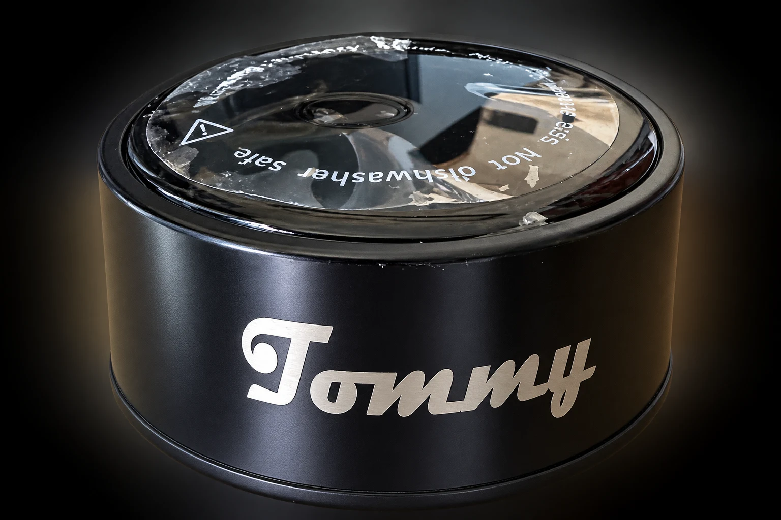 Black tumbler lid engraved with the name Tommy